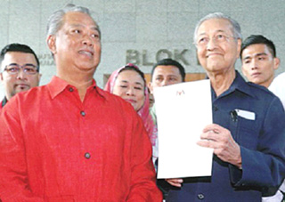 Mahathir says may team up with Anwar